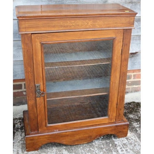 504 - A late 19th century walnut and inlaid pier cabinet enclosed single glazed door, 30