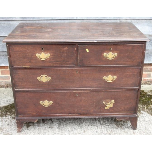 516 - A Georgian provincial oak chest of two short and two long graduated drawers, on bracket feet, 44