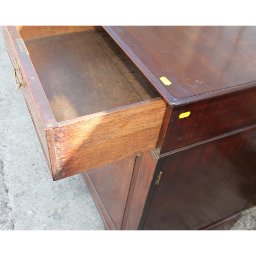 524 - A 19th century mahogany side cupboard, fitted two drawers over two doors, on bracket feet, 47