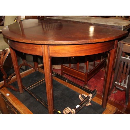 532 - A 19th century mahogany semicircular side table, on chamfered and moulded supports, 46