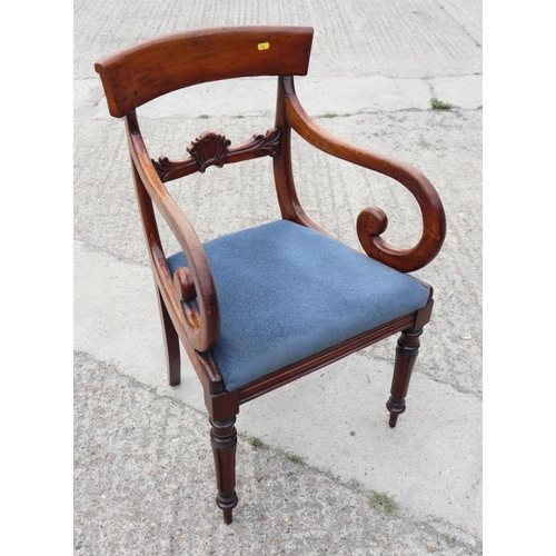 533 - An early 19th century mahogany bar back carver dining chair with drop-in seat, on turned supports, a... 