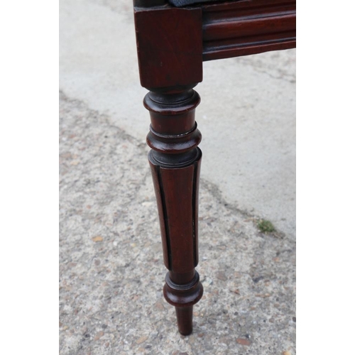 533 - An early 19th century mahogany bar back carver dining chair with drop-in seat, on turned supports, a... 