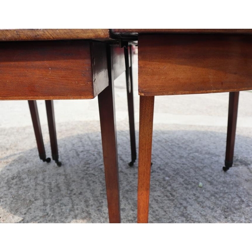 535 - A late Georgian mahogany dining table with centre section, on square taper supports and brass bracke... 