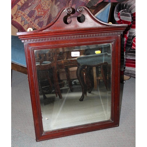 589 - A mahogany framed wall mirror with swan neck pediment, plate 17