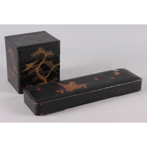 103 - A Japanese scholar's lacquered desk accessory, a lacquered three-compartment box, a document box and... 