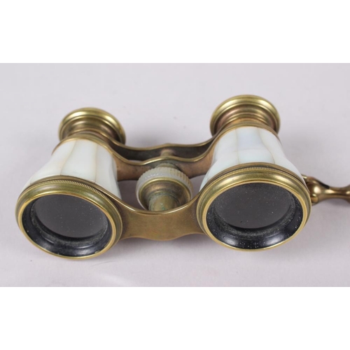 119 - A pair of mother-of-pearl and gilt metal opera glasses, on telescopic handle