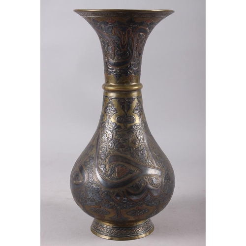 147 - A 19th century silver and copper inlaid waisted vase, 11