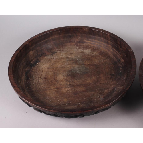 155 - A pair of turned wood African bowls, sides carved crouching figures, 13 1/2