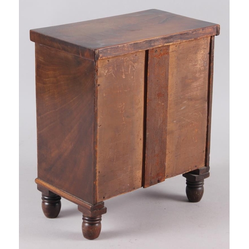 160 - A 19th century miniature mahogany chest of two short and two long drawers, 8 1/2