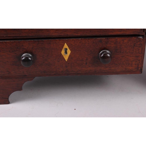 165 - A 19th century miniature chest of two short and three long drawers, on bracket supports, 10