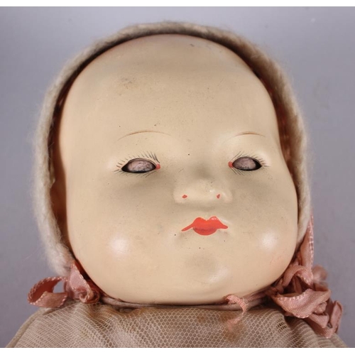 177 - An Armand & Marseille bisque doll with sleeping eyes, closed mouth, jointed body and original clothi... 