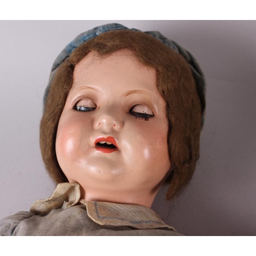 177 - An Armand & Marseille bisque doll with sleeping eyes, closed mouth, jointed body and original clothi... 