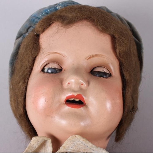 177 - An Armand & Marseille bisque doll with sleeping eyes, closed mouth, jointed body and original clothi... 