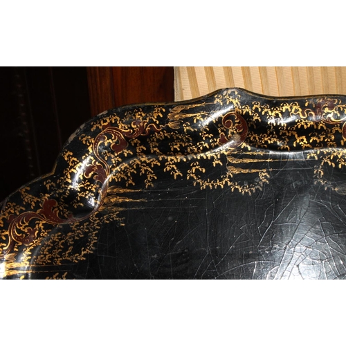 218 - A 19th century papier-mache tray with gilt decorated border, 30