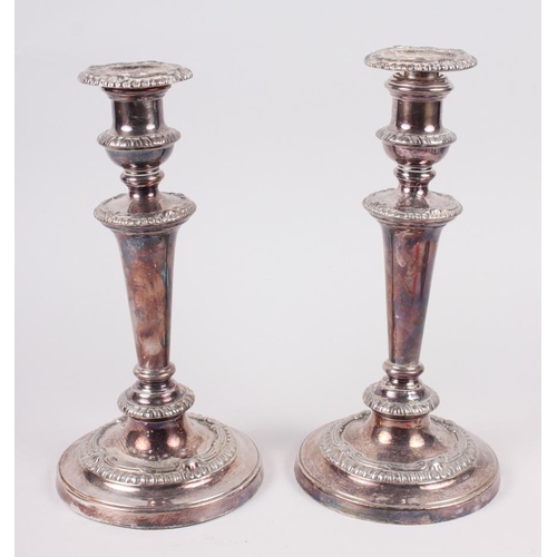 274 - A pair of Georgian design silver plated candlesticks with gadroon borders, 10