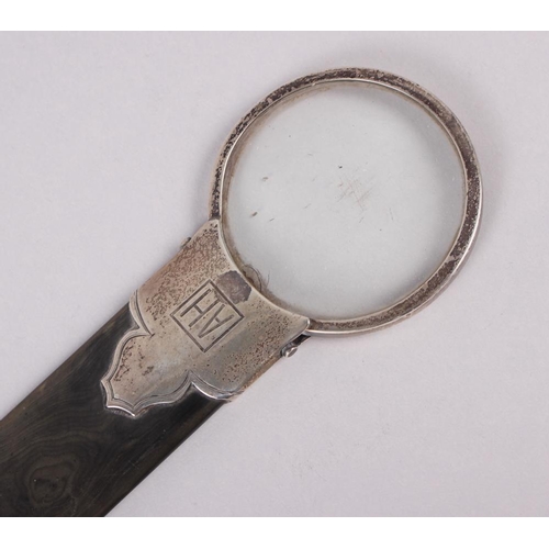 292 - A tortoiseshell page turner with silver top inset magnifying glass