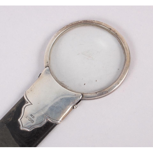 292 - A tortoiseshell page turner with silver top inset magnifying glass