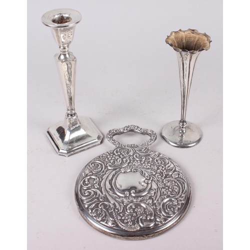 311 - A silver hand mirror, a filled silver candlestick and a silver specimen vase with weighted base