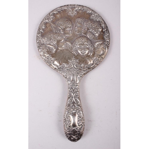 315 - A pair of squat silver candlesticks embossed cherubs' heads, and a similar hand mirror, pin jar and ... 