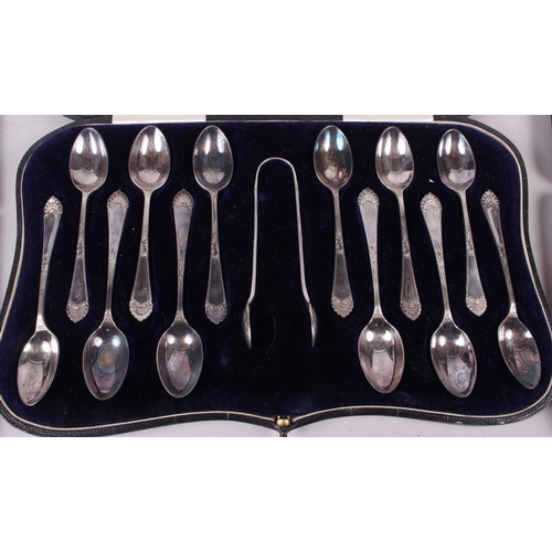 323 - A cased set of six silver apostle teaspoons with matching tongs and two other silver plated sets of ... 