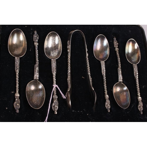 323 - A cased set of six silver apostle teaspoons with matching tongs and two other silver plated sets of ... 