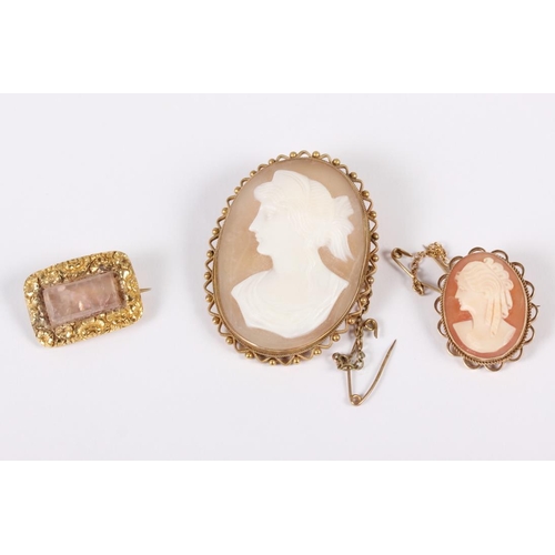 347 - A carved shell cameo brooch with 9ct gold mount, a smaller similar and a Georgian yellow metal mourn... 