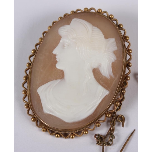 347 - A carved shell cameo brooch with 9ct gold mount, a smaller similar and a Georgian yellow metal mourn... 