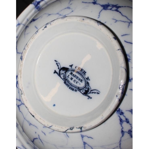 35 - A Chintz decorated toilet set and another similar with blue marbled decoration