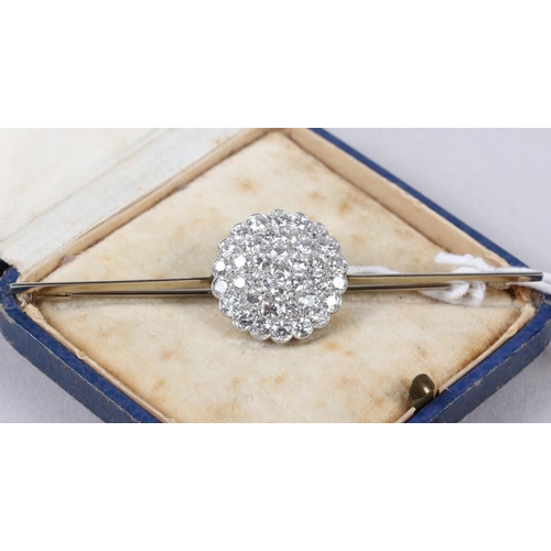 351 - A white metal and diamond cluster bar brooch