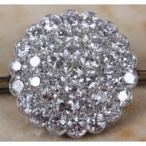 351 - A white metal and diamond cluster bar brooch