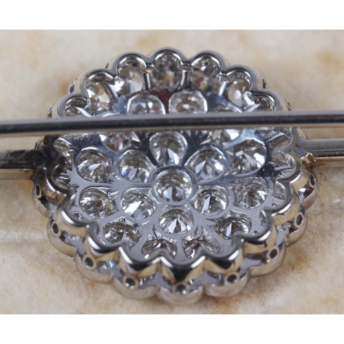 351 - A white metal and diamond cluster bar brooch