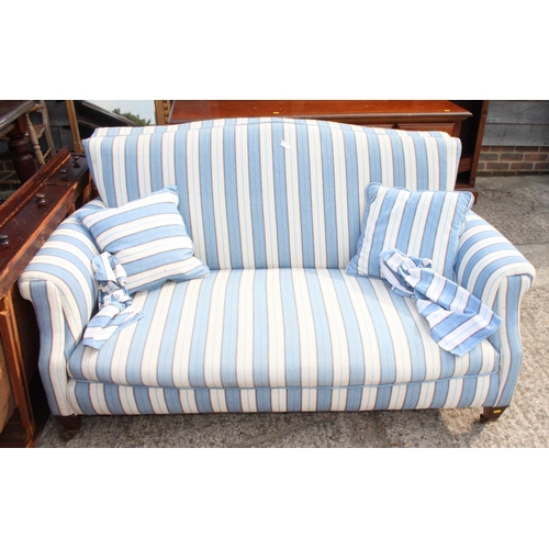 506 - A 19th century three-seat settee, upholstered in a blue and white stripe fabric, on short square tap... 