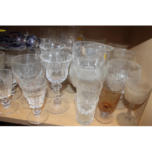 51 - A quantity of glassware, including six champagne flutes, brandy balloons, tumblers, jugs, a cake sta... 