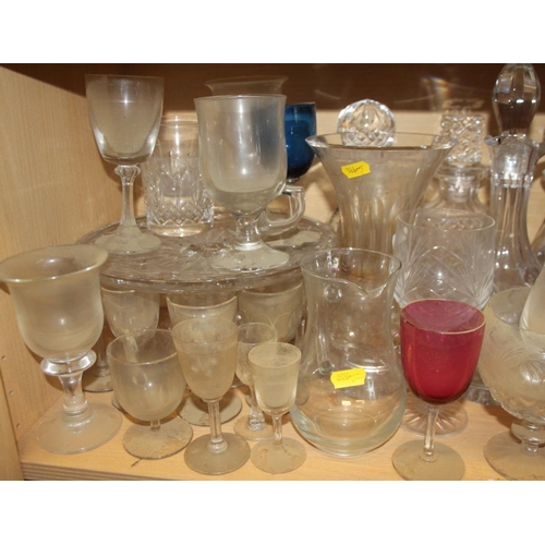 51 - A quantity of glassware, including six champagne flutes, brandy balloons, tumblers, jugs, a cake sta... 