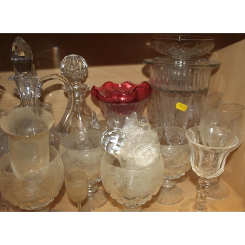 51 - A quantity of glassware, including six champagne flutes, brandy balloons, tumblers, jugs, a cake sta... 