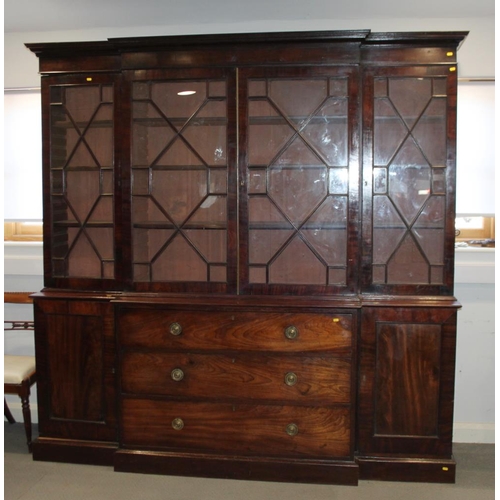 520 - An early 19th century mahogany breakfront library bookcase, fitted astragal beaded glazed doors, bas... 