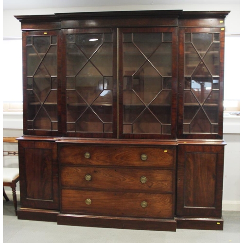 520 - An early 19th century mahogany breakfront library bookcase, fitted astragal beaded glazed doors, bas... 