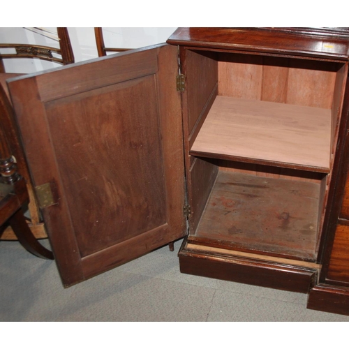 520 - An early 19th century mahogany breakfront library bookcase, fitted astragal beaded glazed doors, bas... 