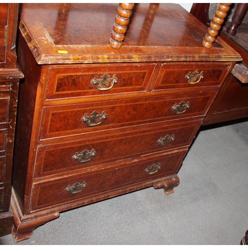 541 - A Georgian walnut and mahogany banded chest of two short and three long drawers with brass handles, ... 