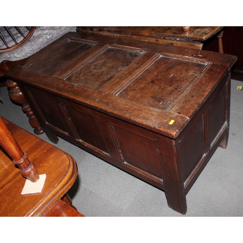 550 - A 17th century oak coffer with plain three panel front and lid, 50