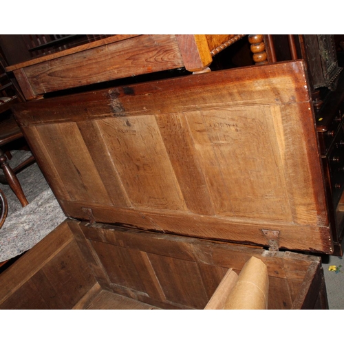 550 - A 17th century oak coffer with plain three panel front and lid, 50