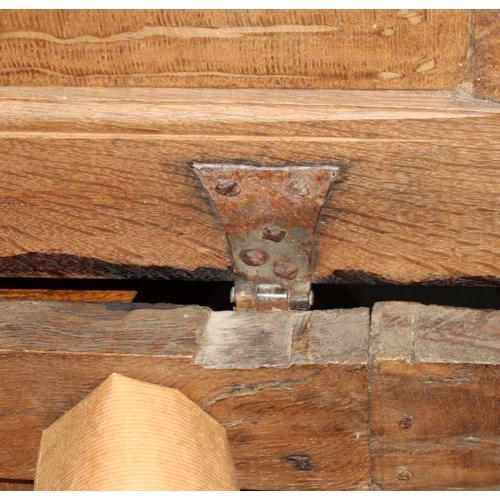 550 - A 17th century oak coffer with plain three panel front and lid, 50