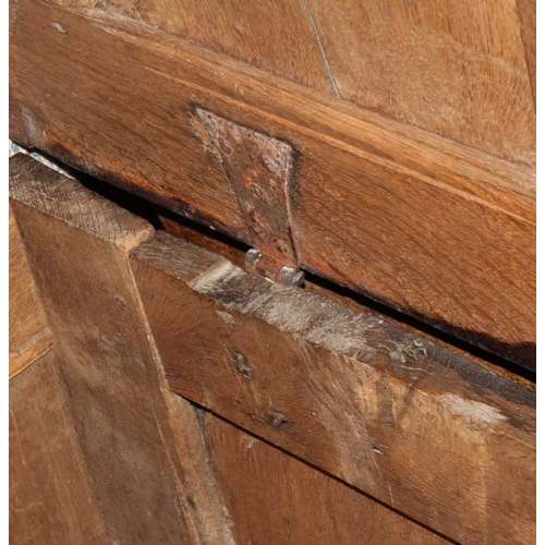 550 - A 17th century oak coffer with plain three panel front and lid, 50