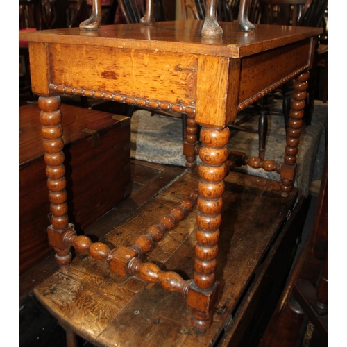 551 - A 19th century oak side table, fitted frieze drawer, on bobbin turned supports, 36