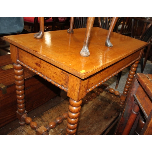 551 - A 19th century oak side table, fitted frieze drawer, on bobbin turned supports, 36