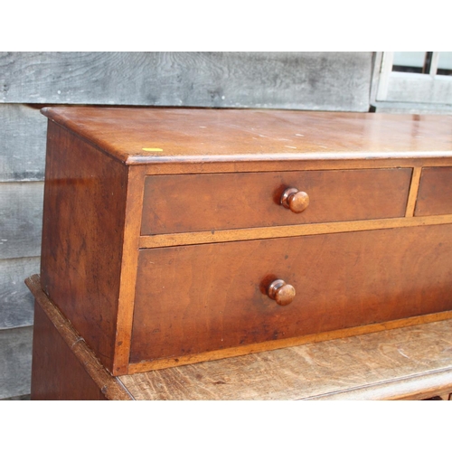 556 - A 19th century mahogany chest of two short and one long drawer with turned wooden knobs, 37