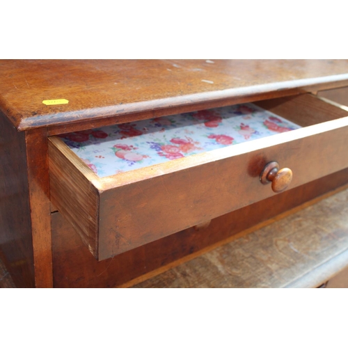 556 - A 19th century mahogany chest of two short and one long drawer with turned wooden knobs, 37