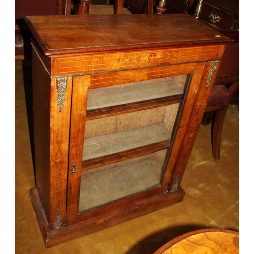 565 - A Victorian inlaid walnut pedestal display cabinet with single glazed door, inlaid frieze and gilt m... 