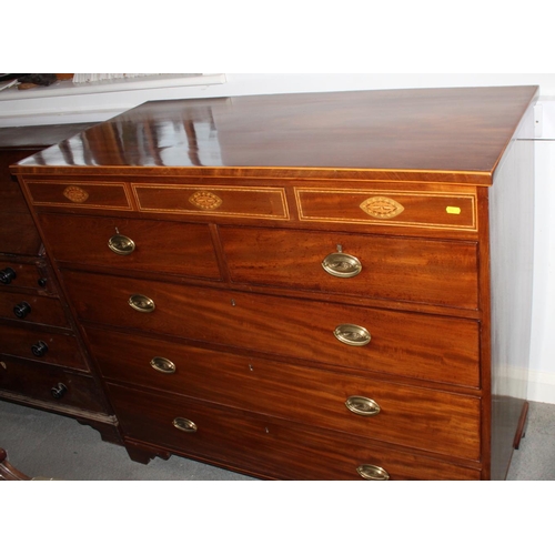 568 - A George IV mahogany chest of two short and three long drawers with oval brass handles, and conceale... 