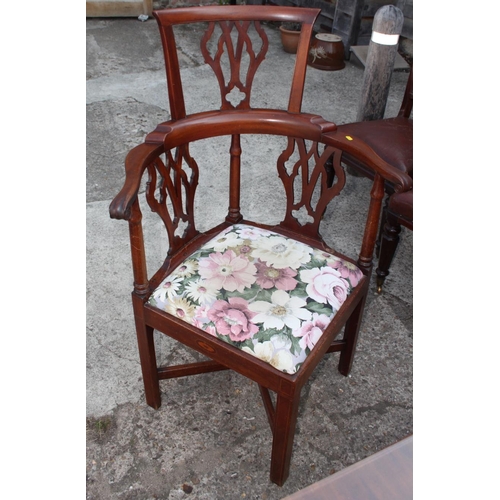 572 - A George III mahogany corner chair with pierced vase shaped splats and seat rails inlaid shells